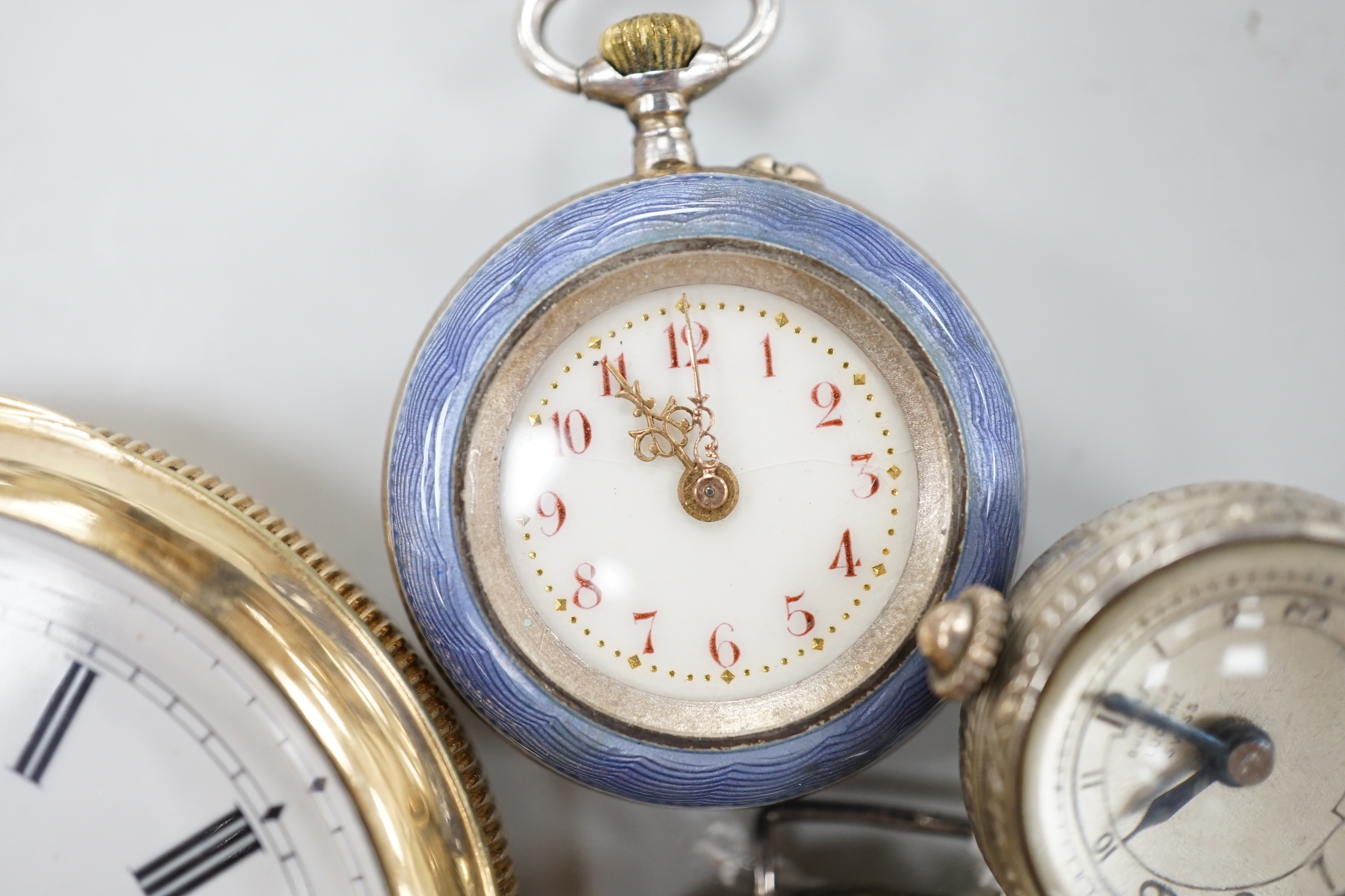 A gold plated open face pocket watch, a silver wrist watch, three fob watches including Art Nouveau 935 and enamelled and a globe watch.